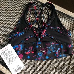 Super cute. Brand New, never worn, with tags LuLuLemon sports bra. Size 4.
